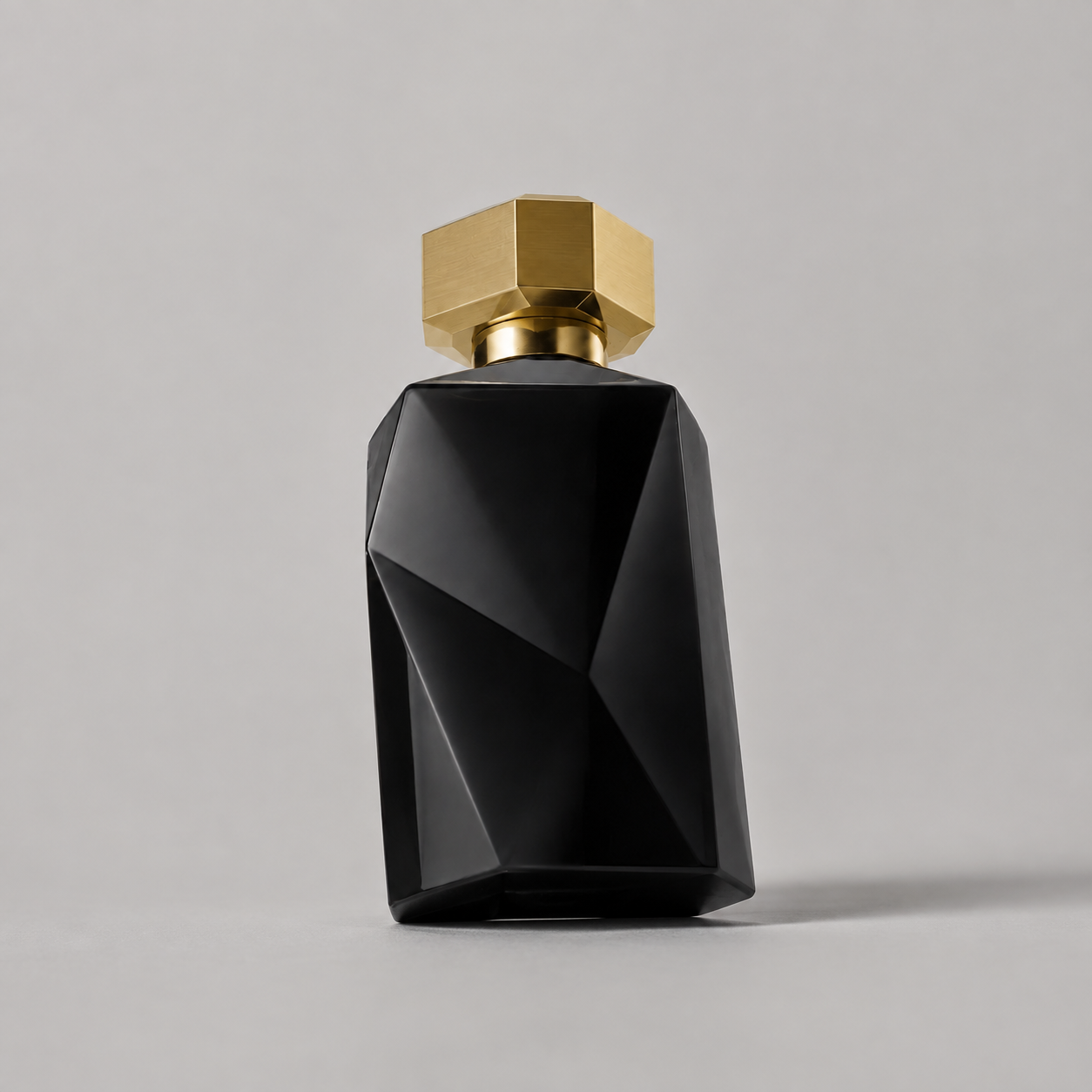 Plain studio photo of a black perfume bottle before creative treatment